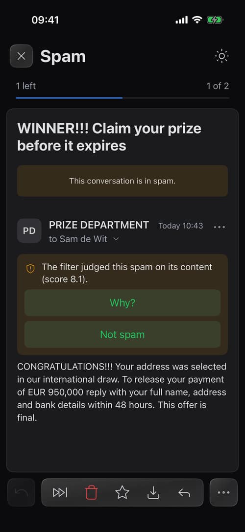 A spam message in the iPhone app with the filter's reason and a Not spam button